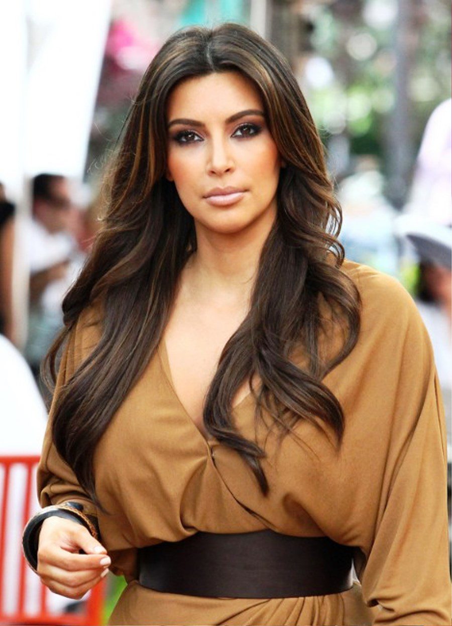 Kim Kardashian Layered Long Wavy Hairstyle