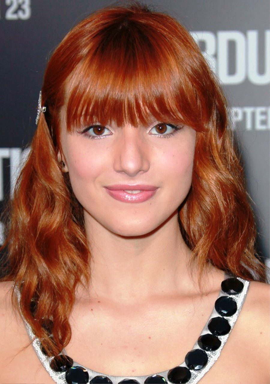 Long Red Wavy Hairstyle With Bangs