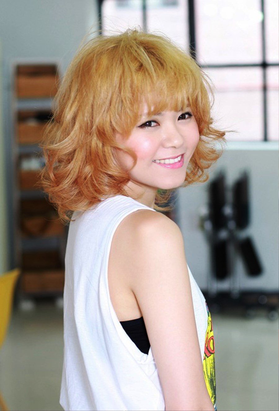 Short Curly Hairstyle With Cute Bangs