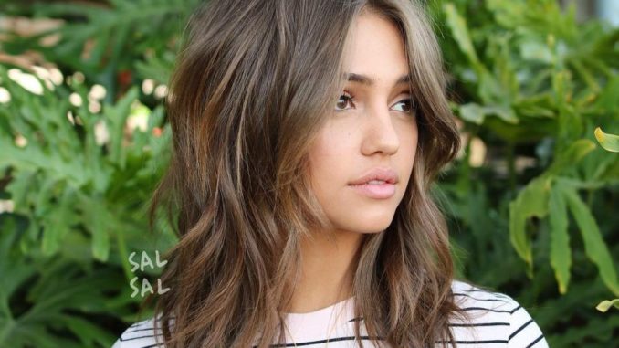 Shoulder-Length Wavy Cut with Curtain Bangs Save