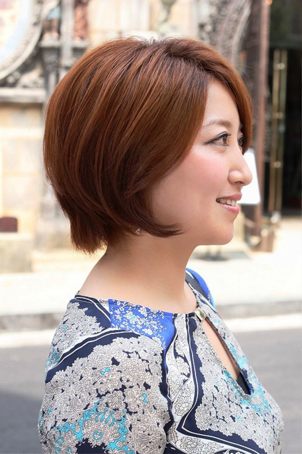 Side View Of Short Auburn Bob Hairstyle