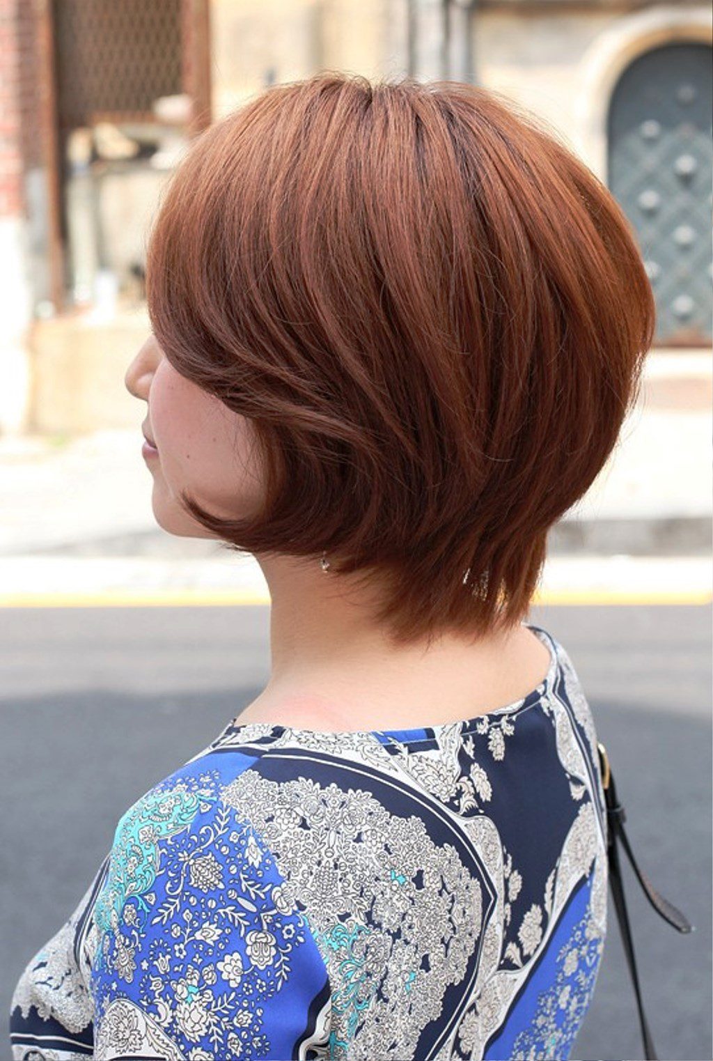 Side View Of Short Auburn Haircut For Women