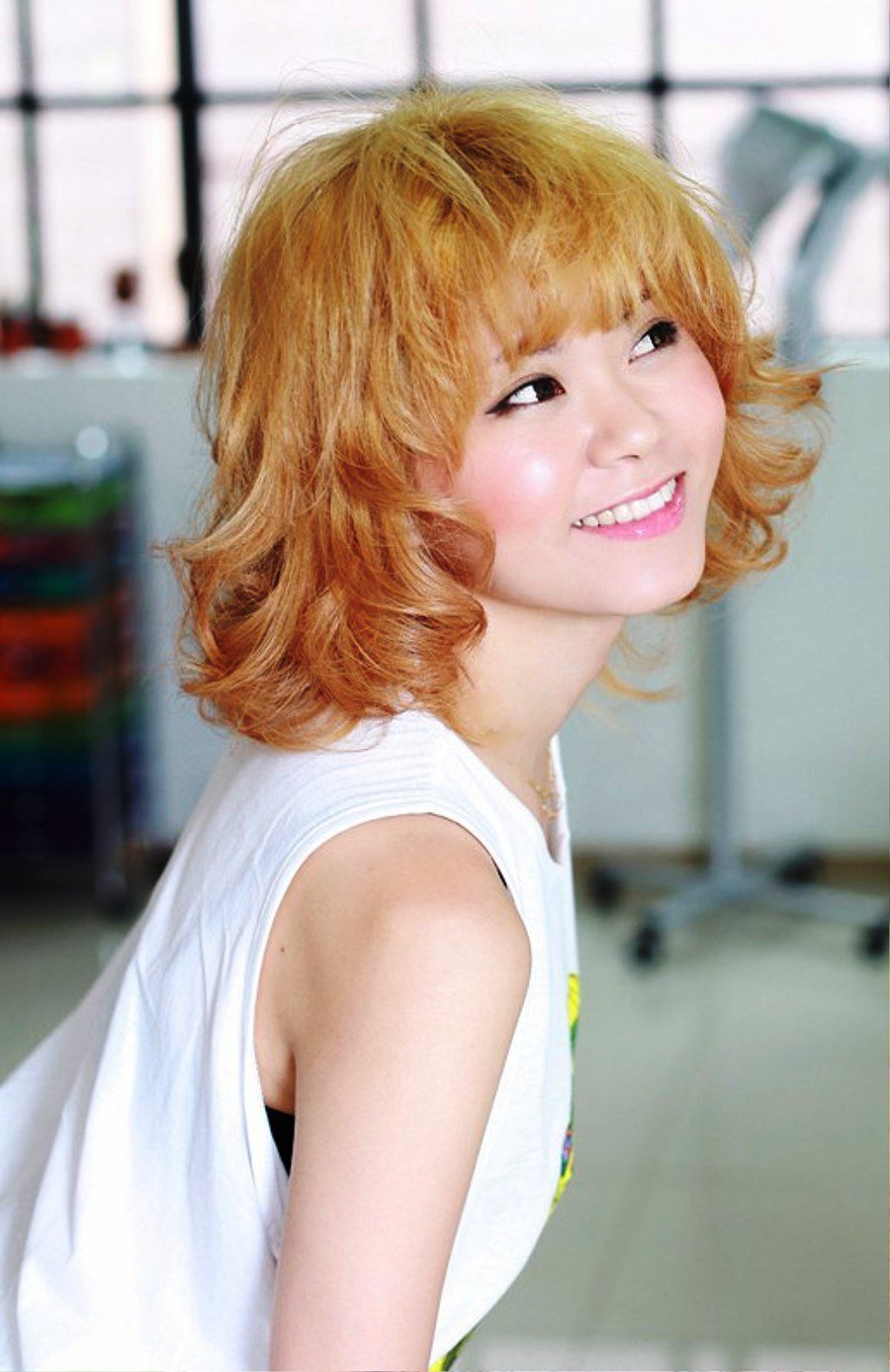 Sweet Short Blonde Curly Hairstyle With Bangs